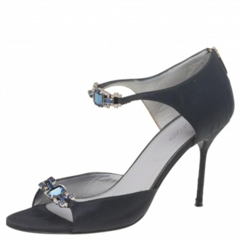 Dazzling and oh so gorgeous, these Sergio Rossi sandals are worth the splurge! The black satin construction is enhanced with crystal-embellished details. Equipped with comfortable leather-lined insoles, these beauties stand tall on 9.5 cm heels.