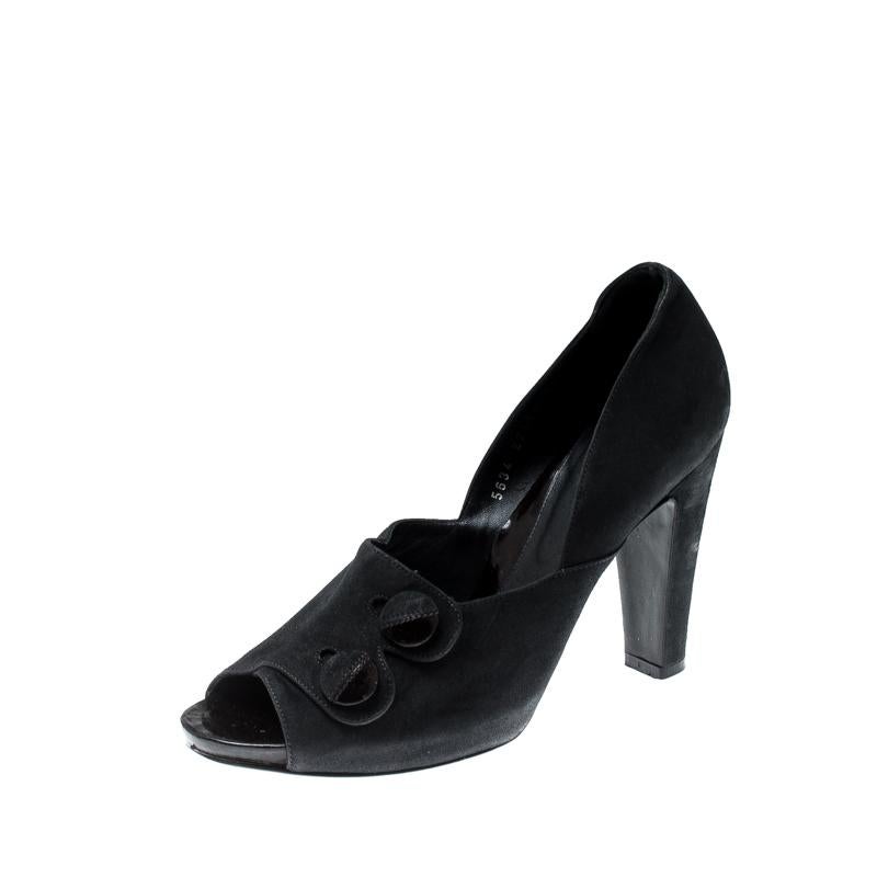 Crafted out of smooth and durable suede, these pumps are a functional pick for all events. They feature button details and peep toes. From the house of Sergio Rossi, add this black pair of luxury footwear to your wardrobe today.

