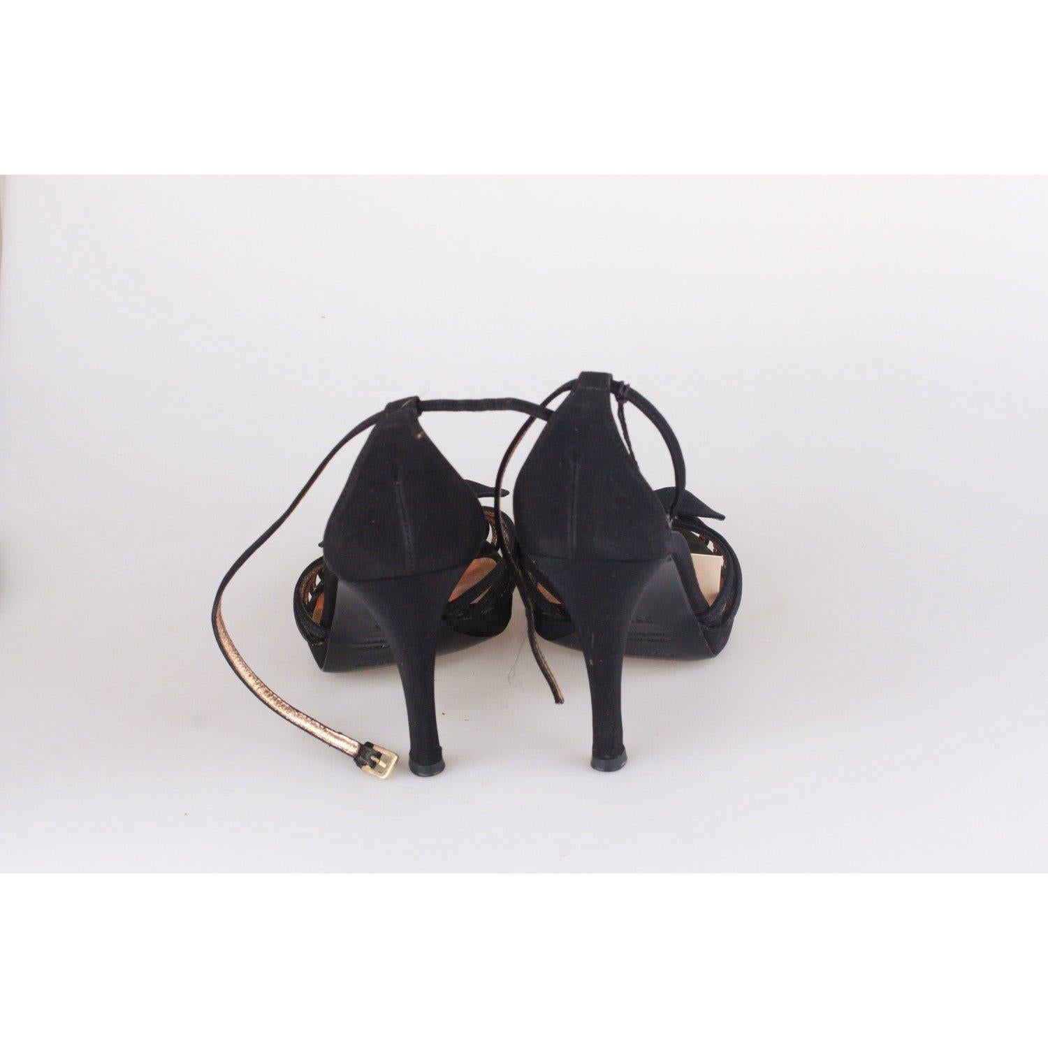 MATERIAL: Suede COLOR: Black MODEL: D'orsay GENDER: Women CONDITION DETAILS: Some scartcehs and wear of use on the outsoles Any other detail which is not mentioned may be seen on the item pictures. Please do ask if anything is not clear or you may