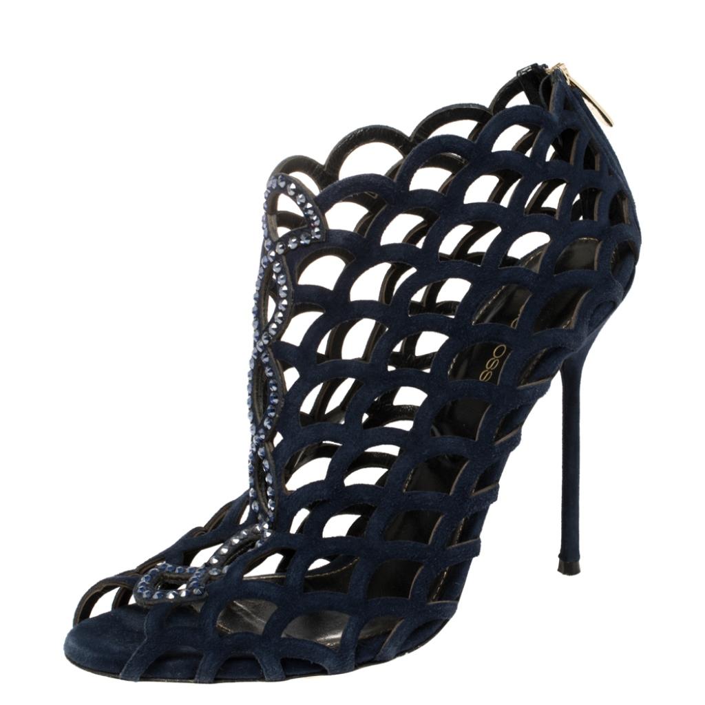 Exquisite, enchanting, and very stylish, these booties from Sergio Rossi will make your heart skip a beat! The blue booties are crafted from suede and feature a peep-toe silhouette. They flaunt a scalloped caged design with crystal embellishments.