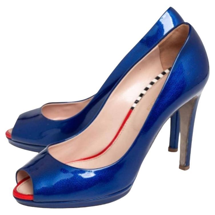 Those stylish outfits will look a lot more appealing with these pumps from Sergio Rossi. They have been crafted from blue patent leather into a peep-toe silhouette and elevated on 10 cm heels. They are easy to slip on and come endowed with