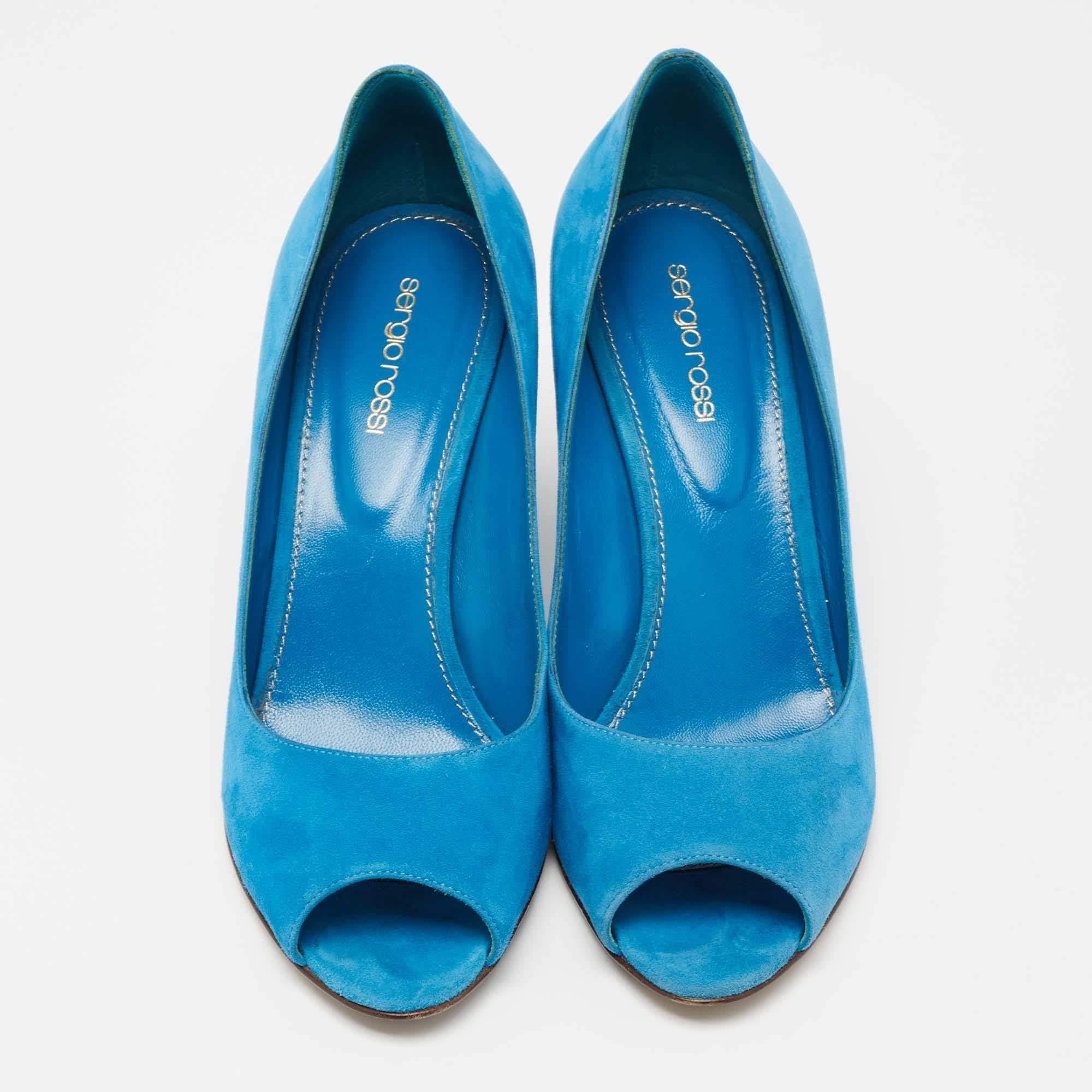 These Sergio Rossi pumps are elegant, feminine, and easy to style. Made from soft suede, they flaunt an appealing shade of blue and covetable peep-toes. The pair is complete with 9 cm wedge heels for the right amount of elevation.

