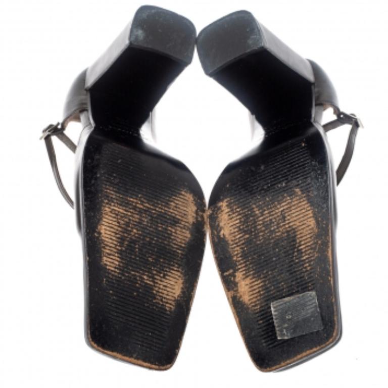 These fashionable pumps from Sergio Rossi are crafted with dark grey leather. This pair features covered, square toes, ankle closure, comfortable insoles, and block heels. These dark grey pumps offer both elegance and comfort.