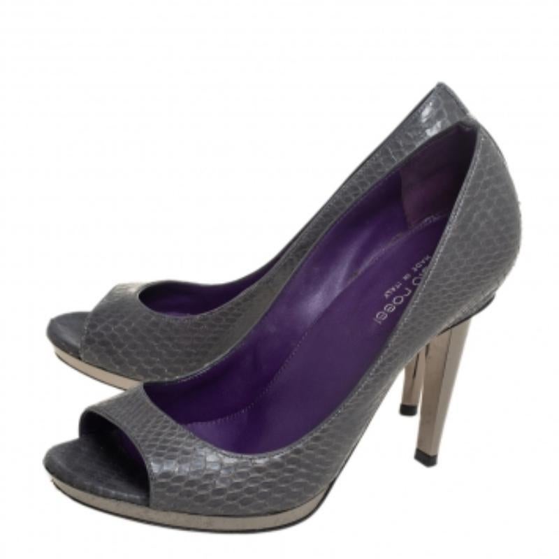 This pair of amazing pumps by Sergio Rossi sets the standard of sophistication. The python exterior gives the pair an amazing texture and the heels offer the appropriate elevation. Have a stylish day out with your friends while flaunting this pair