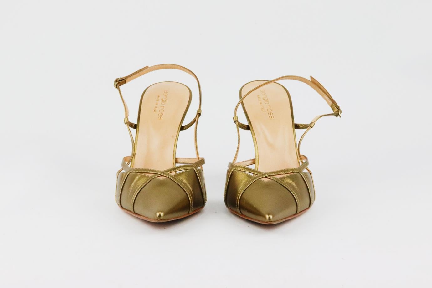 These pumps by Sergio Rossi are made from smooth gold leather and framed with a cutout detail, plus a slingback strap to gracefully follow the shape of your foot. Heel measures approximately 76 mm/ 3 inches. Metallic leather. Buckle fastening at