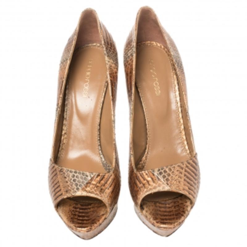 We've fallen head over heels in love with these pumps from Sergio Rossi! They are crafted from metallic snakeskin leather and styled with open toes, platforms, and 12.5 cm heels. Truly high fashion, this lovely pair will effortlessly bring out the