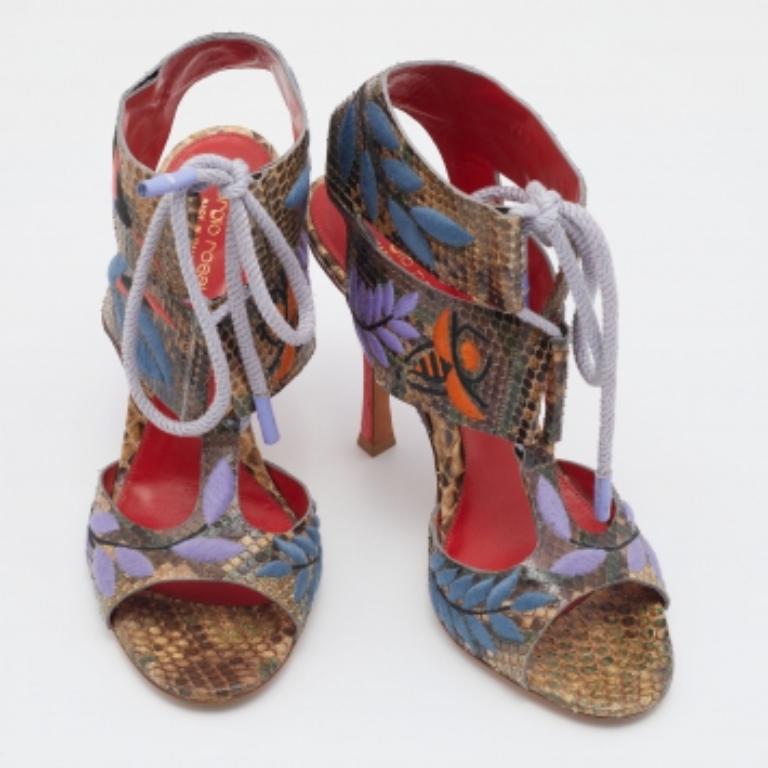 Filled with striking elements, these Sergio Rossi sandals will bring a touch of elegance to your every step, The ankle tie will gracefully hug your feet and their 11cm heels will elevate you with ease. Crafted from python leather, the beautiful