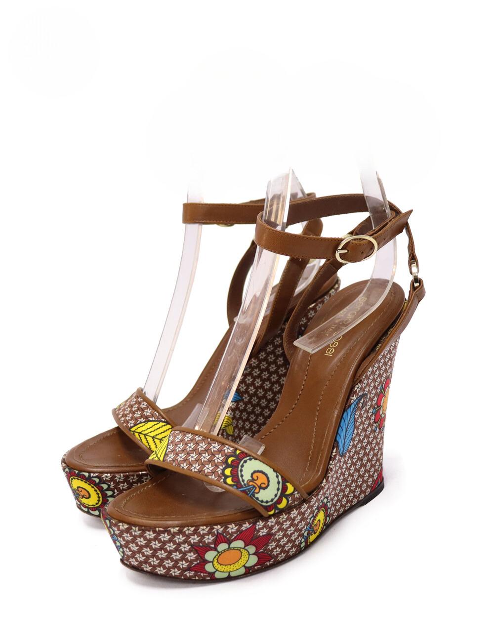 Sergio Rossi Multicolor Printed Leather Ankle-Wrap Wedge Platform Sandals.

Material: Leather and Satin
Heel Height: 11cm
Platform Height: 2cm
Size: EU 37
Overall Condition: Excellent.
Interior Condition: Signs of use.
Exterior Condition: Barely