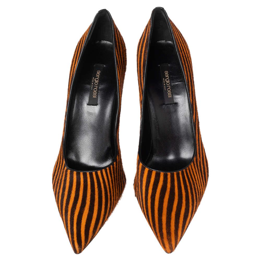 Flaunt high style with every step, and fetch admiring gasps your way every time you step out wearing these pumps from Sergio Rossi. The pumps carry a striped pony hair exterior and they are made whole with pointed toes and slim heels.

