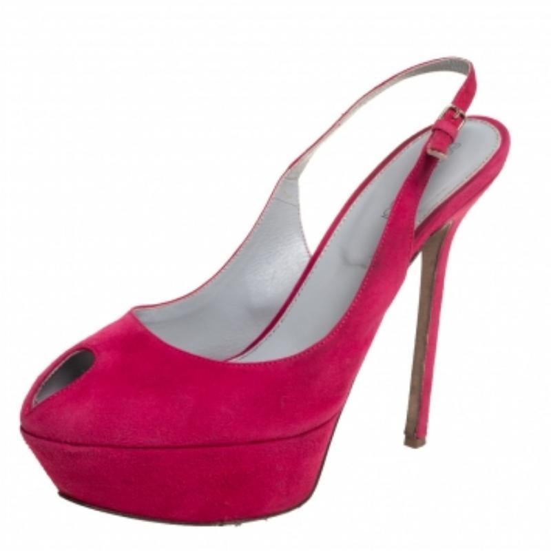 Put your best foot forward wherever you go in these pretty Sergio Rossi sandals. They've been crafted from pink suede and designed with peep toes. Buckle-held slingbacks, platforms, and 14 cm heels beautifully complete the pair. These sandals are