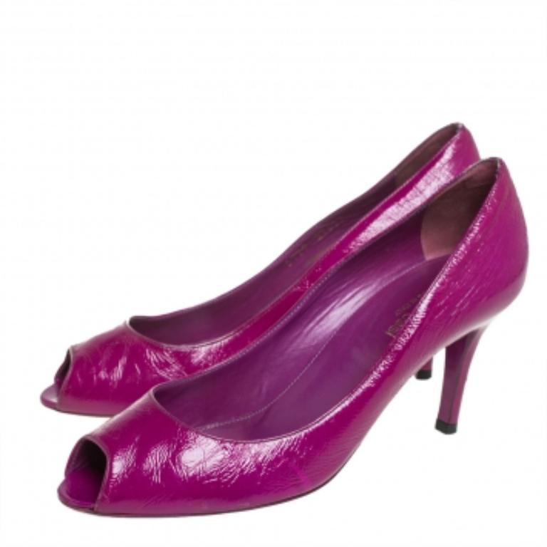 When has Sergio Rossi not impressed us with its fabulous designs? It does so, yet again with these lovely pumps. The purple pumps are crafted from leather and styled with peep-toes and 7.5 cm heels. They are made comfortable with leather-lined