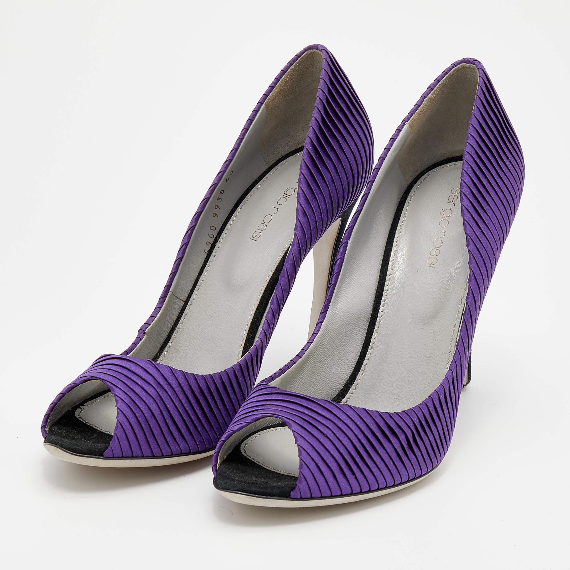 Project an elegant take in a comfortable manner with these timeless pumps by Sergio Rossi. Crafted in Italy from satin in a purple shade, they feature peep toes, pleats, and 11 cm heels.