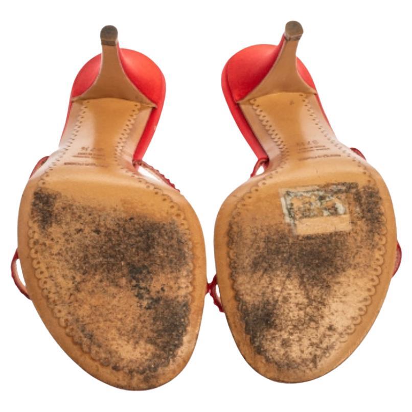 Dazzling and oh so gorgeous, these Sergio Rossi sandals are worth the splurge! The red satin construction is enhanced with cut-out detailed crystal-embellished vamp straps. Equipped with comfortable leather-lined insoles, these beauties stand tall