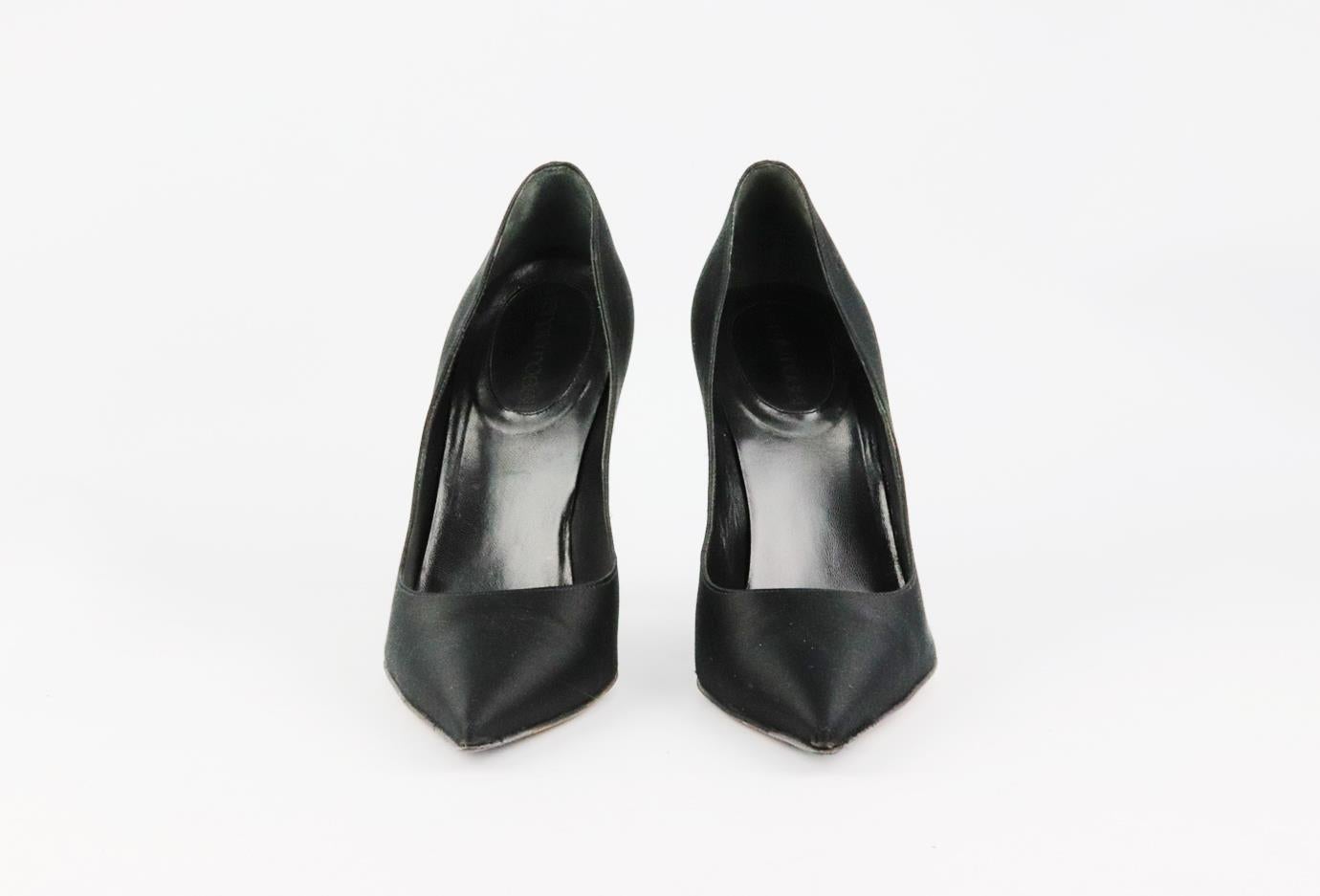 These pumps by Sergio Rossi are a classic style that will never date, made in Italy from black satin, they have sharp pointed toes and striking 89 mm structured heels to take you from morning meetings to dinner with friends. Heel measures