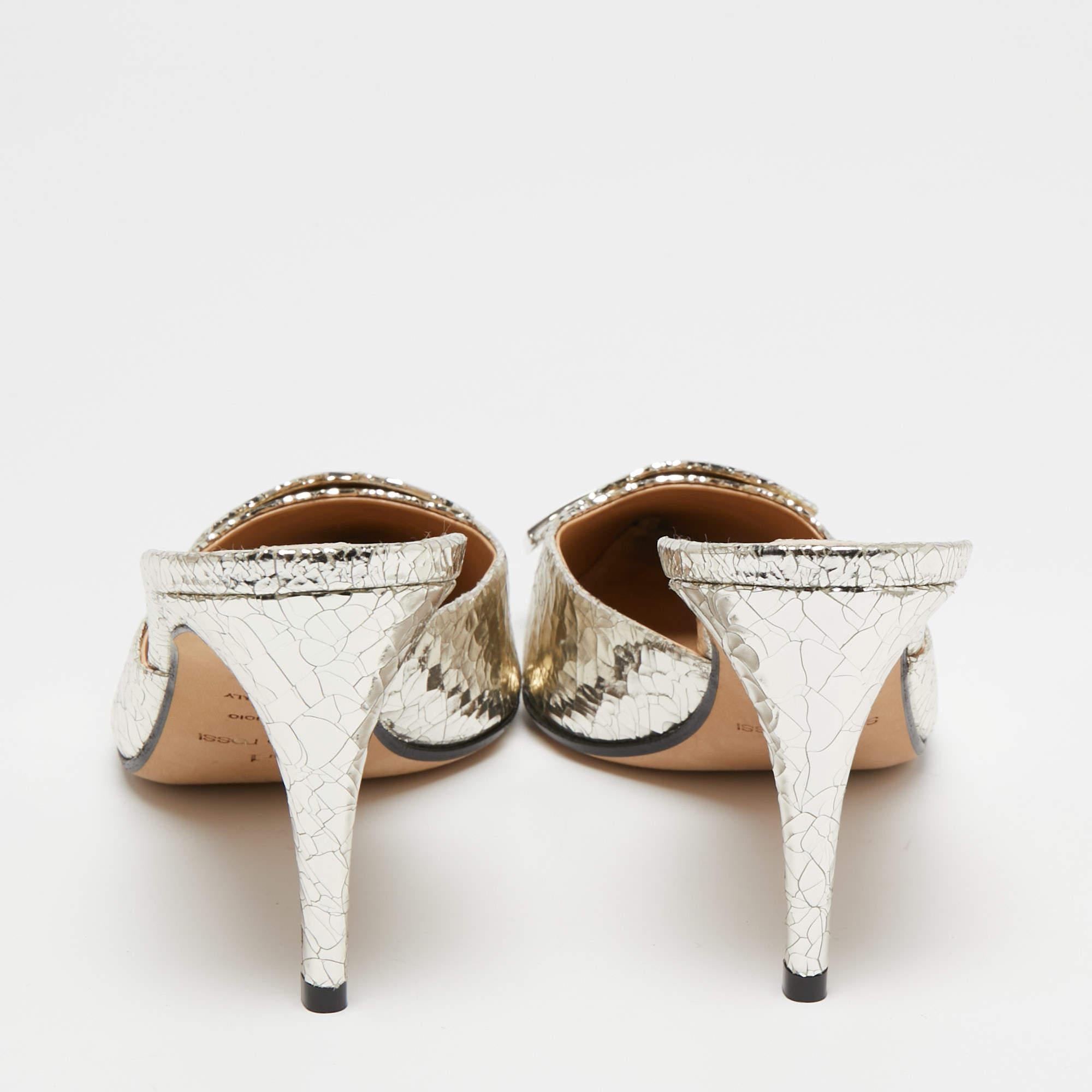 How pretty are these mules from Sergio Rossi! Fashioned in silver croc-embossed leather, these mules are elevated with silver-tone hardware. They are finished with pointed toes, slender heels, and a slip-on style. Revamp your outfit with these