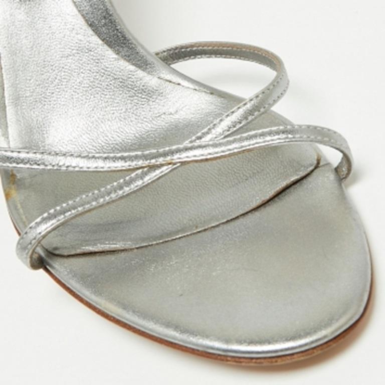 The crystal embellishment on the ankle strap serves as a striking element of these Sergio Rossi sandals. Crafted from leather, it features an intertwined strap on the vamps, 9cm heels, and an ankle buckle closure.