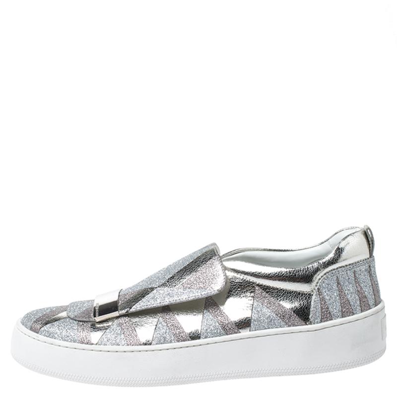 To accompany your attires with ease, Sergio Rossi brings you this pair of sneakers that speak nothing but high style. They've been crafted from metallic leather and feature glitter and round toes. The sneakers are easy to slip on and they are