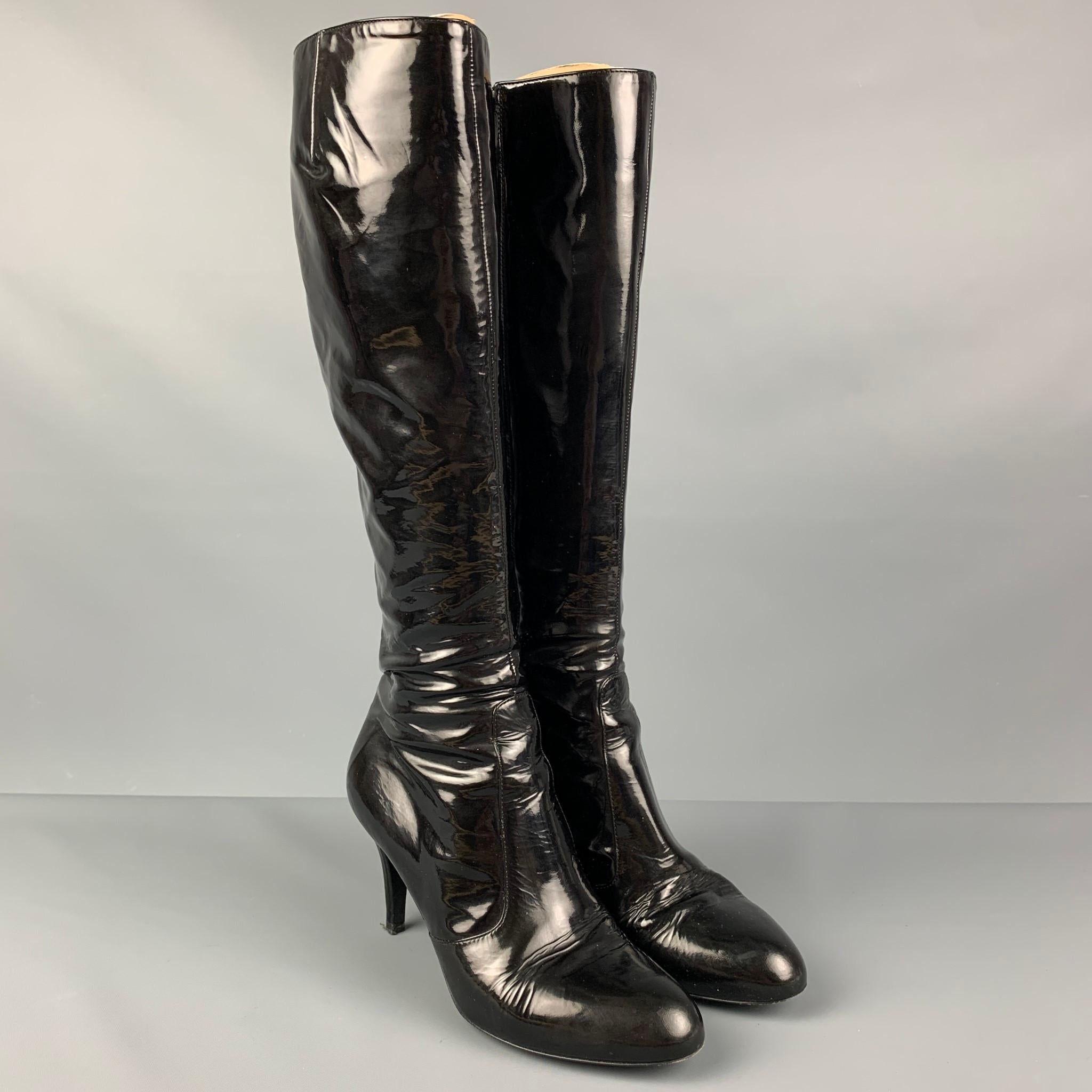 SERGIO ROSSI boots comes in a black patent leather with a purple lining featuring a stacked heel and a sie zipper closure. 

Good Pre-Owned Condition. Light wear.
Marked: 8262 8050 36.5

Measurements:

Length: 9 in.
Width: 3 in.
Height: 15 in. 