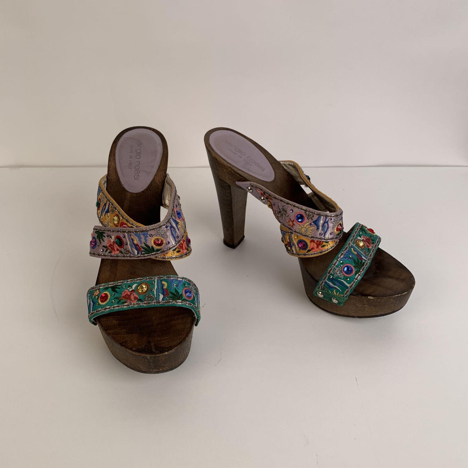 Sergio Rossi wooden mules with multicolored straps. Rhinestones embellishment. Made in Italy.1 inch platform. Size: 37 Heels height: 5 inches - 12,7 cm



Details

MATERIAL: Wood

COLOR: Multicolor

MODEL: Clogs

GENDER: Women

SIZE: