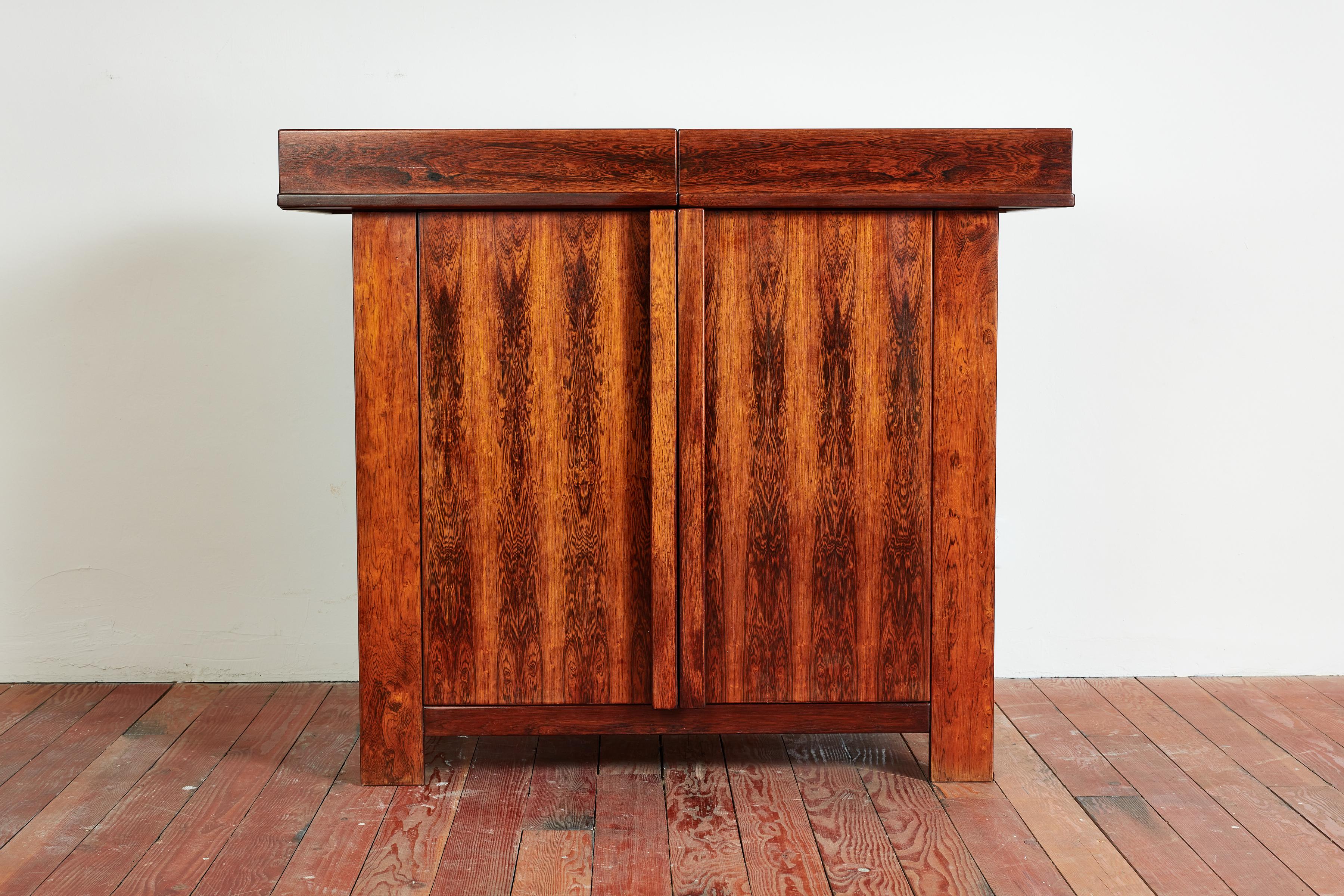 Gorgeous Italian sideboard by Sergio and Giorgio Saporiti, circa 1960s
Unique shape and function - top tiers open up to reveal storage. 
2 Door cabinet with shelving. 
Jacaranda wood with incredible contrasting grain.
 