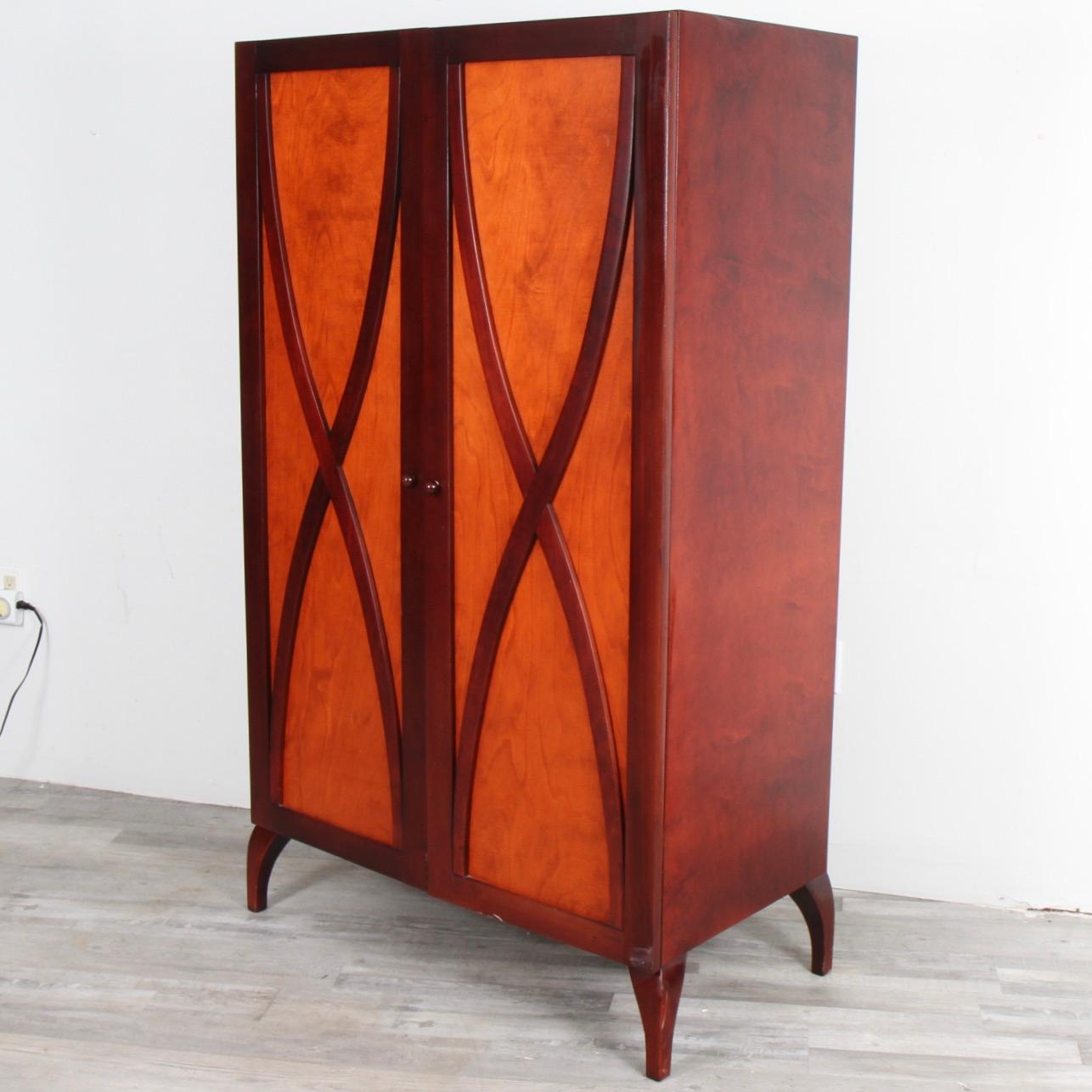 This media cabinet is just one of the many fantastic designs that husband and wife, Monique & Sergio Savarese, founders of Dialogica created before the untimely death of Sergio in 2006. The piece is made of cherry front door inserts with a mahogany