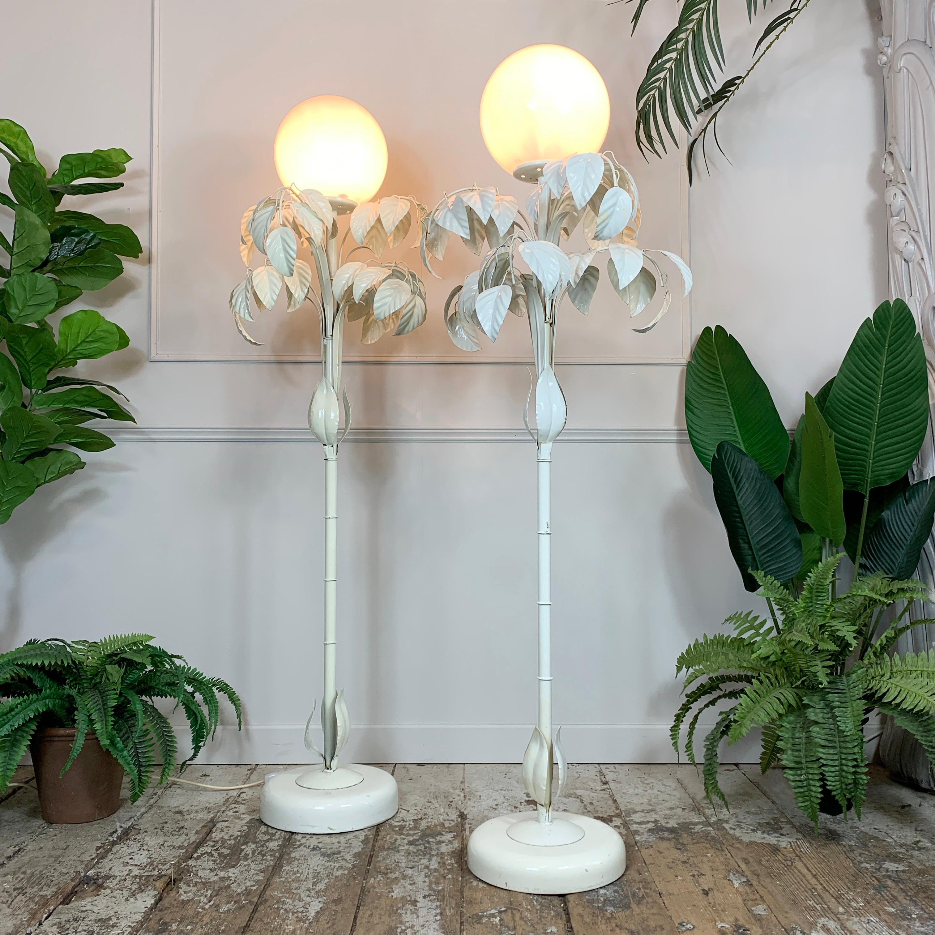 A spectacular Pair of 1970’s Sergio Terzani Italian white enamel floor lamps, a canopy of leaves and branches surround the large glass globe light fitting, making this lamp an impressive addition to any setting.

Measures: Height 158cm Tall x 50cm