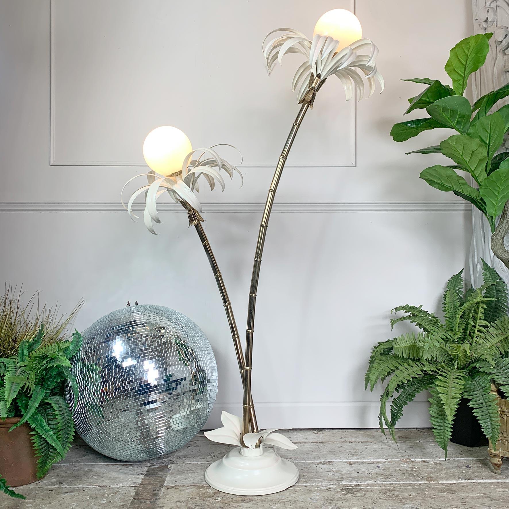 Beautifully elegant palm floor lamp, by Sergio Terzani. Italy, dating from the 1970's

This is a tall and striking Italian floor lamp design, depicting two gilt faux bamboo stems with full soft white palm fronds. The fronds have a dusted pale pink