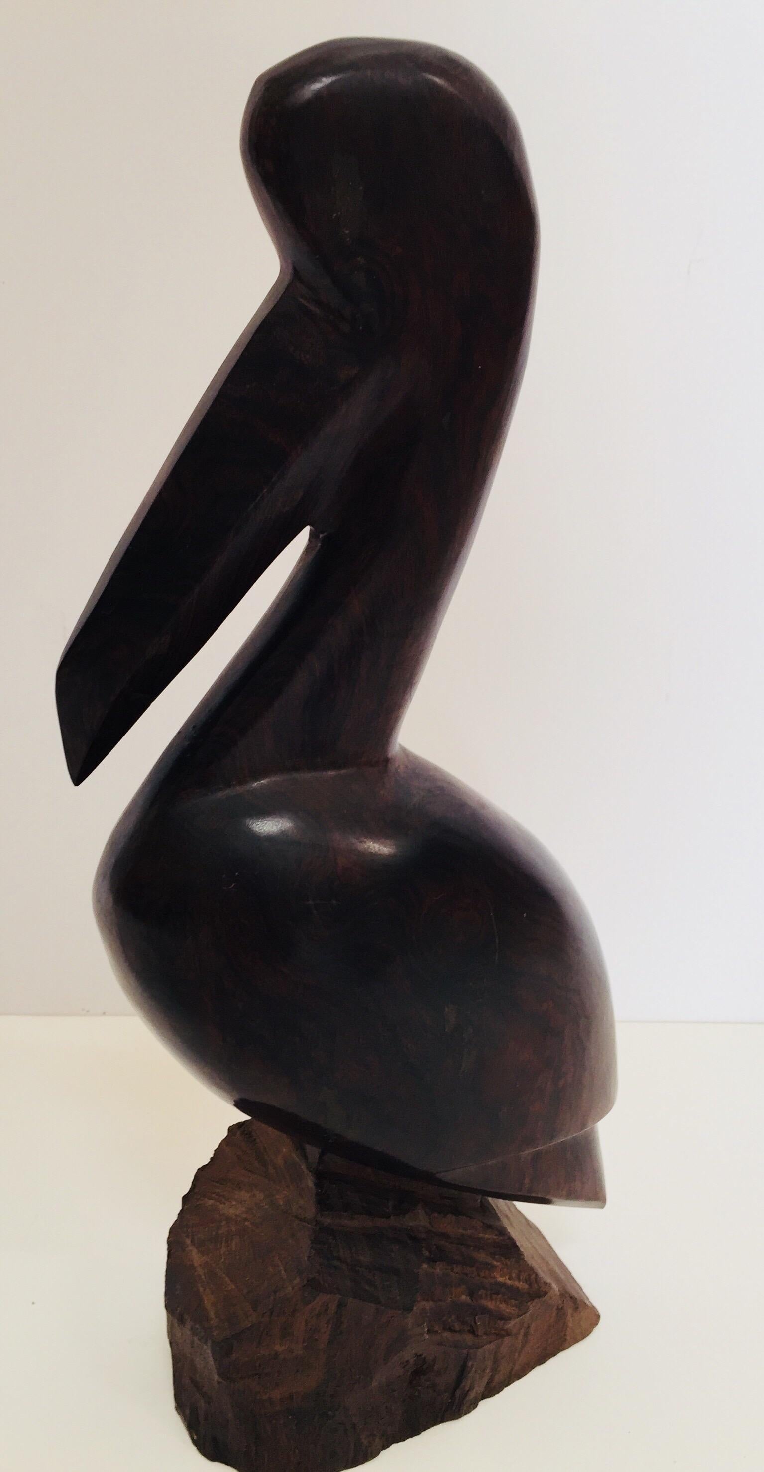 Large vintage hand carved Ironwood Mexican seri sculptures of a pelican and a whale.
Very nice polished heavy dark wood, no dents with a smooth finish over all excellent condition with
beautiful visible wood grains. 
circa 1970.
Pelican: 13.5