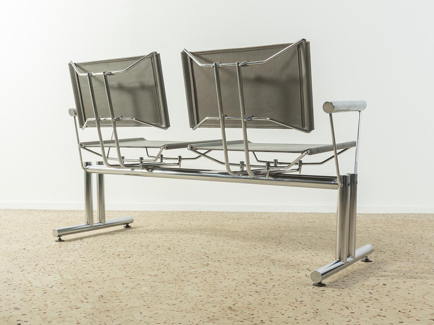 Extraordinary bench from the series 8600 by Hans-Ullrich Bitsch for Kusch & Co from the 1980s. High-quality chromed metal frame with thick leather seat and backrest in grey.

Quality features:
 very good workmanship
 high-quality materials
