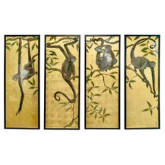 Série de 4 panneaux décoratifs "Singes suspendus aux arbres" signés