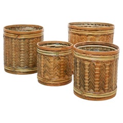 Series of 4 vintage rattan basket planters