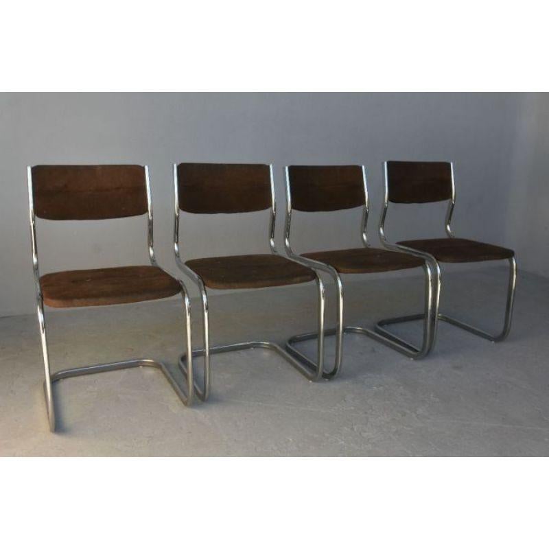 Series of 4 vintage tubular chairs 70 velvet top of dimension height 80 cm for a width of 45 cm and a depth of 52 cm.

Additional information
Style: Vintage 1970
Material: Silver metal, Fabrics & velvet.