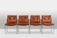 Series of 6 chairs in leather and chromed metal, 1970s