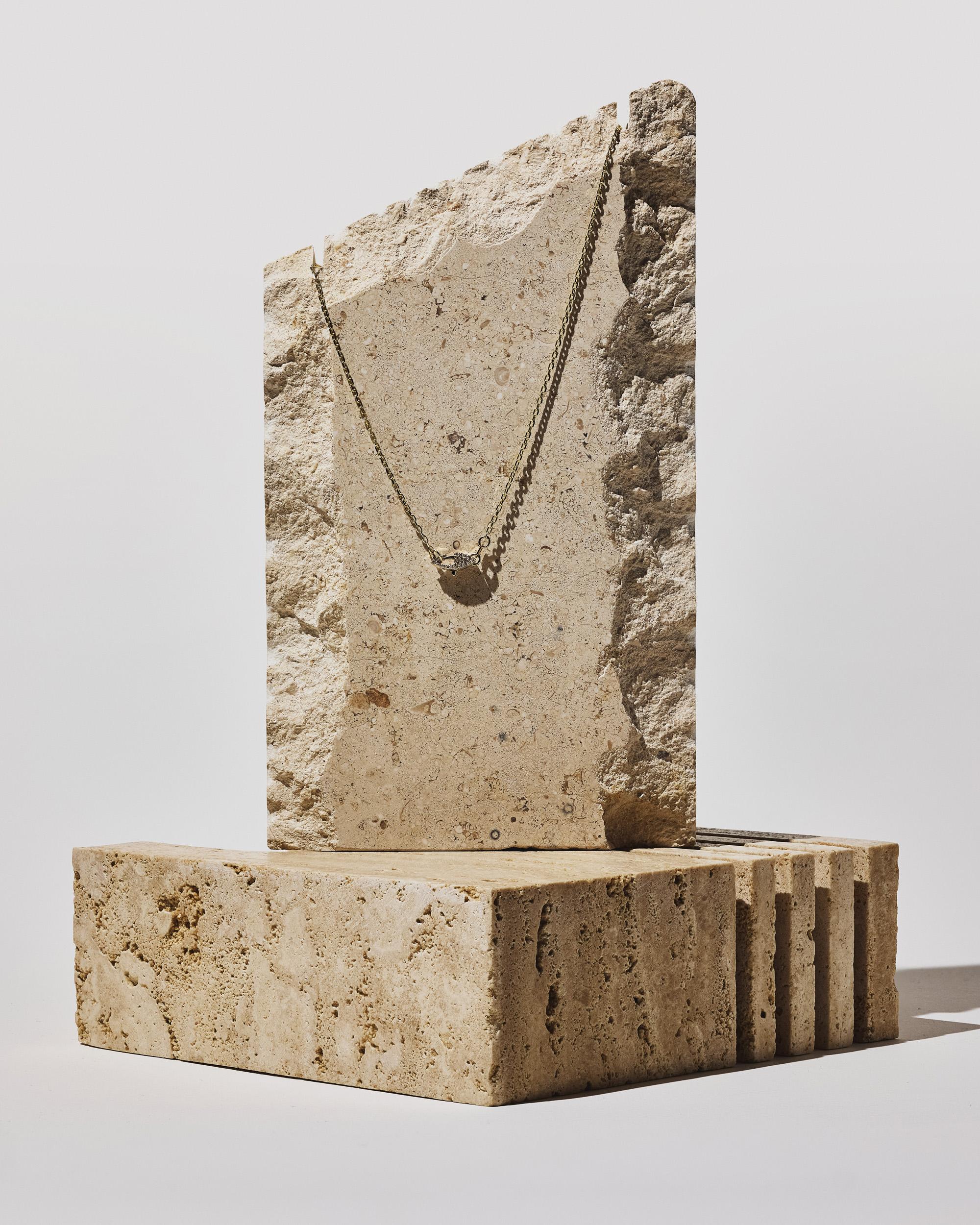 **This style is discounted because the chain length is retired as an option - last piece in stock. 

A solid 14k yellow gold cable chain featuring a custom hand-pavé double-sided diamond clasp. Can be styled with the diamond clasp in the front,