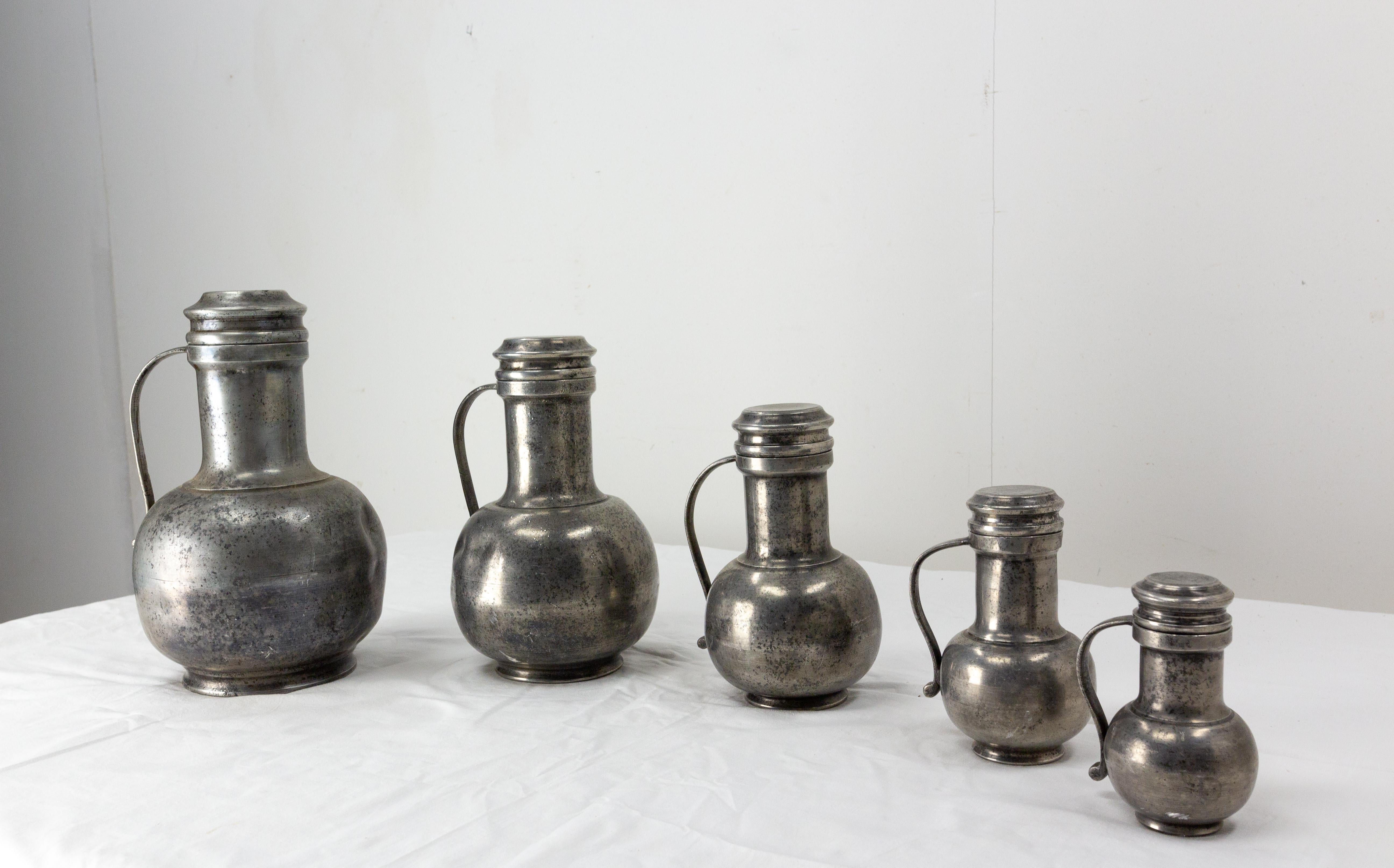 French series of tin Pitchers
late 18th century
Dimension of the biggest pitcher: diam: 7.87, height: 13.19 in. (20 x 33.5 cm)
Dimension of the smallest pitcher: diam: 3.15, height: 5.91 in. (8 x 15 cm)
Good condition

Shipping:
L35 P35 H34