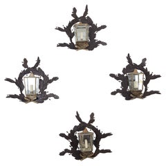 Series of four painted sheet metal sconces, circa 1980, France.