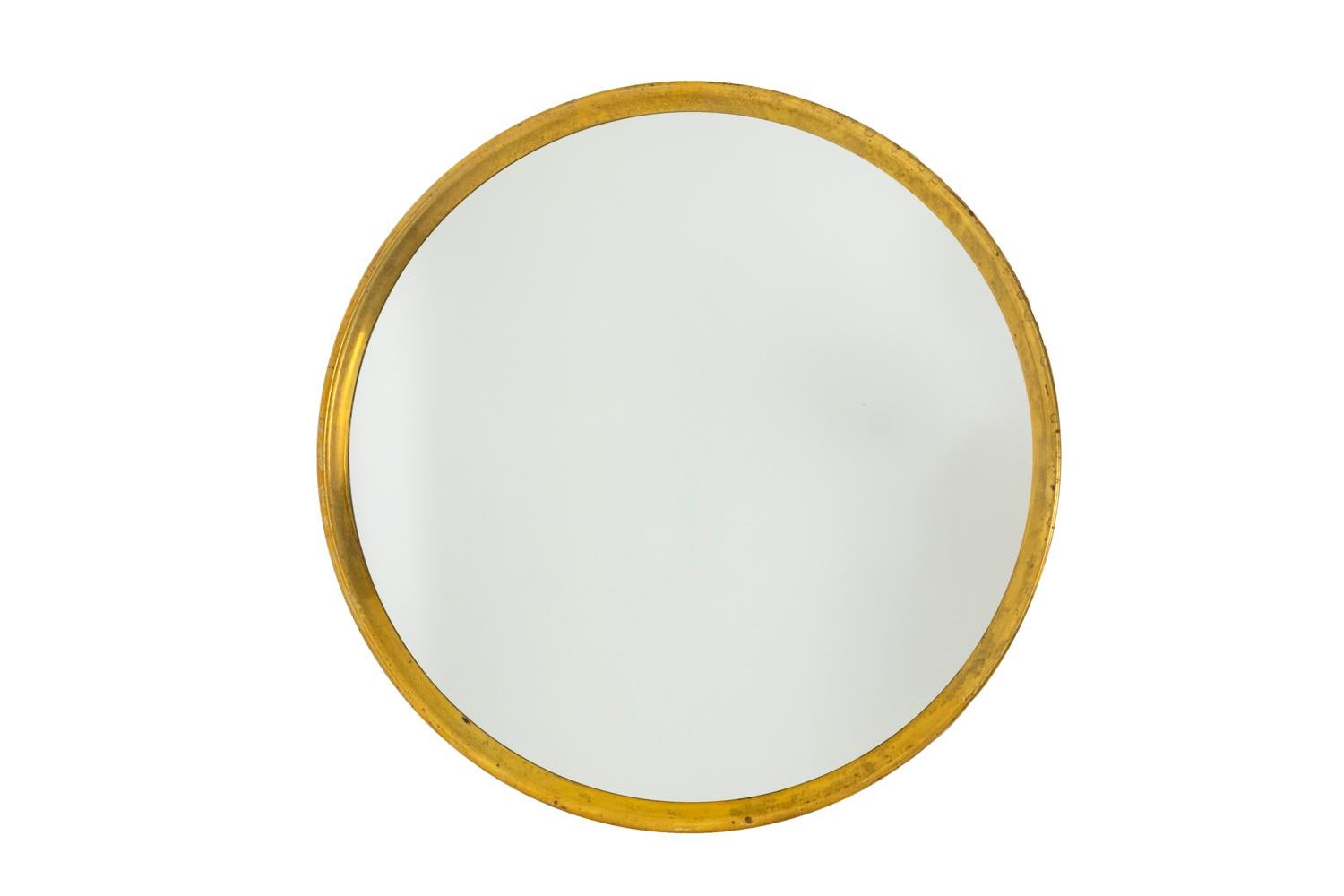 Series of seven small circular mirrors with a thick frame in gilt brass.

Italian work realized in the 1970’s.

 