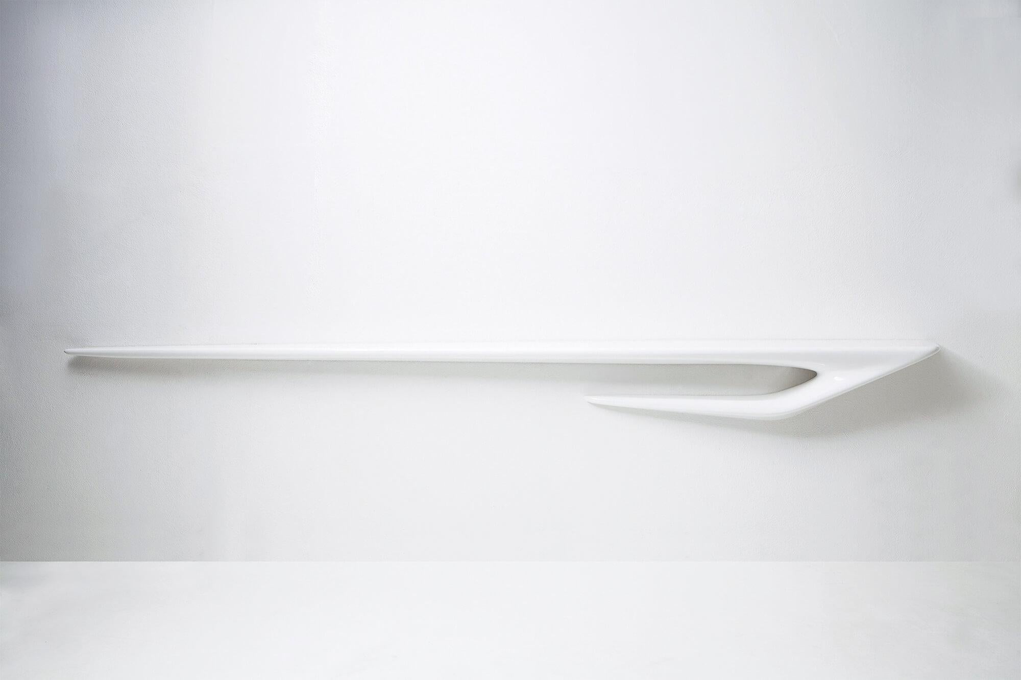 Part of the Seamless collection by Zaha Hadid, the Serif Limited Edition series of shelves are dynamic forms that interact when combined. These wall-mounted masterpieces are a fluid extension of ?the drawn line that has been translated ?into three