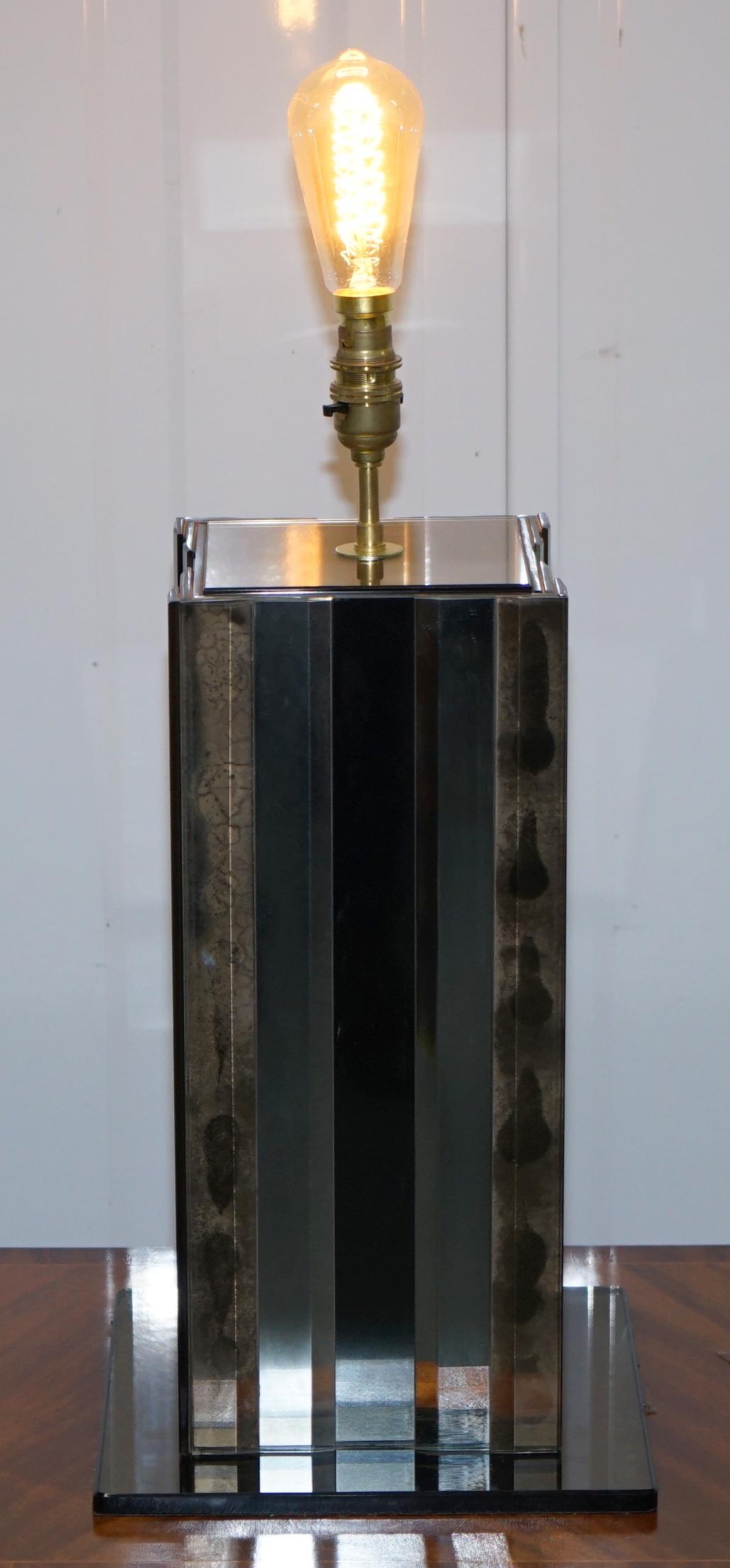 We are delighted to this very cool vintage retro mid century modern 1970's panelled distressed colour mirrored glass table lamp

A very rare find, this is a highly decorative and collectable piece, the glass is a mixture of smoked and plain