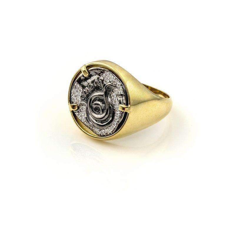 Recycled 14K Yellow Gold

Sterling Silver Rhodium Plated

Diamonds Approx. 0.15 ct

Available in Any Size and Can Be Resized.

Serpent Coin Ring in Gold, Silver and Diamonds.

Apart from symbols of status and wealth, coin rings were considered love