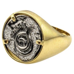 Schlangenmünze-Ring aus Gold, Silber und Diamanten