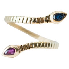 Serpent Gold Ring Featuring Ruby and Sapphire in 14 Karat Yellow Gold