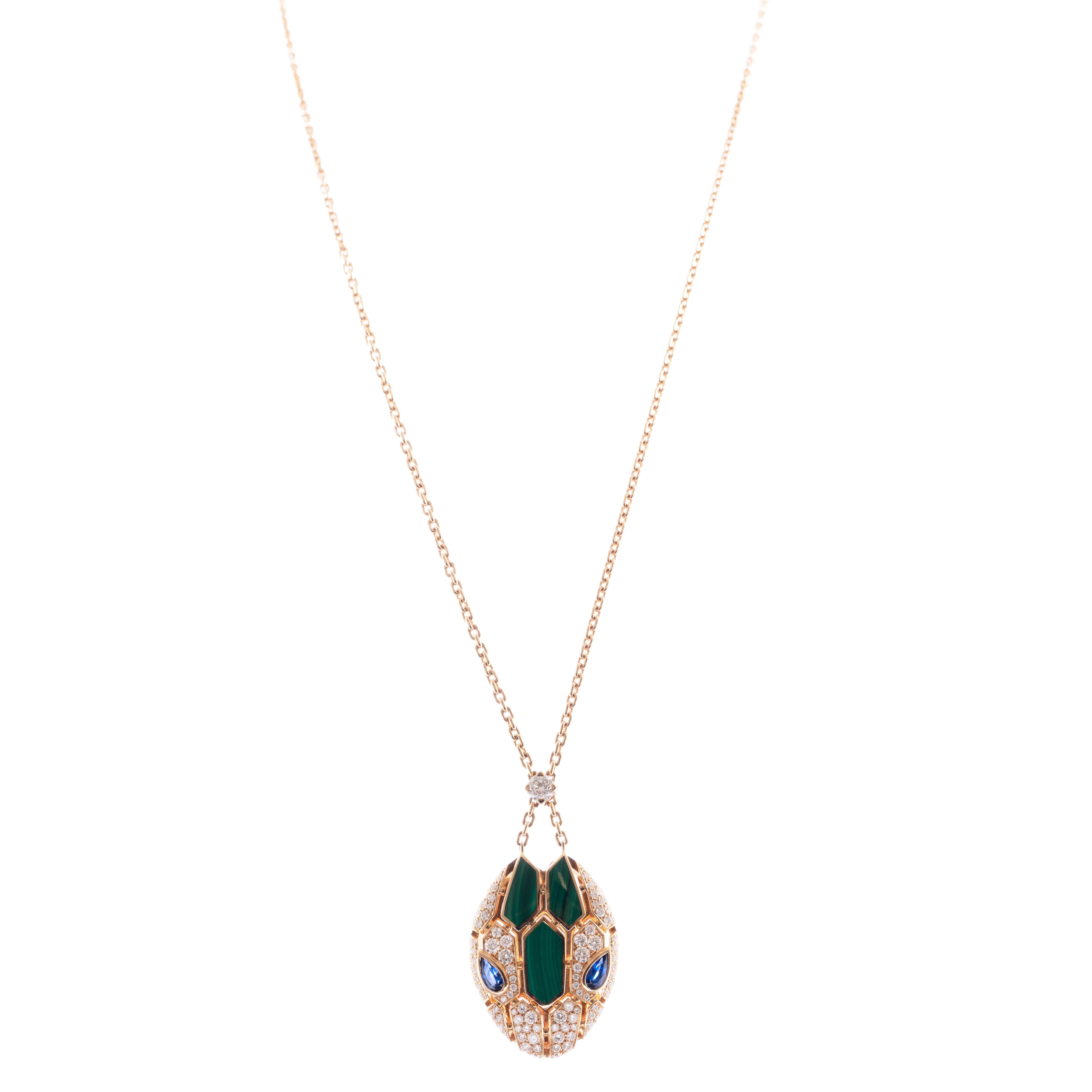 A chic and contemporary snake motif from Bulgari's Serpenti collection. This masterfully designed and creatively fashionable necklace is enhanced by its stunning color combinations of rich green malachite, brilliant white diamonds (1.34 carats), and
