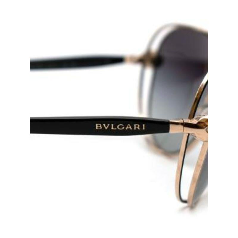 Bvlgari Serpenti Round 6087B Sunglasses
 
 - Full rim round black gradient lenses
 - Gold-Tone metal trim
 - Signature embellished serpenti temple detail
 
 Made in Italy 
 
 PLEASE NOTE, THESE ITEMS ARE PRE-OWNED AND MAY SHOW SIGNS OF BEING STORED
