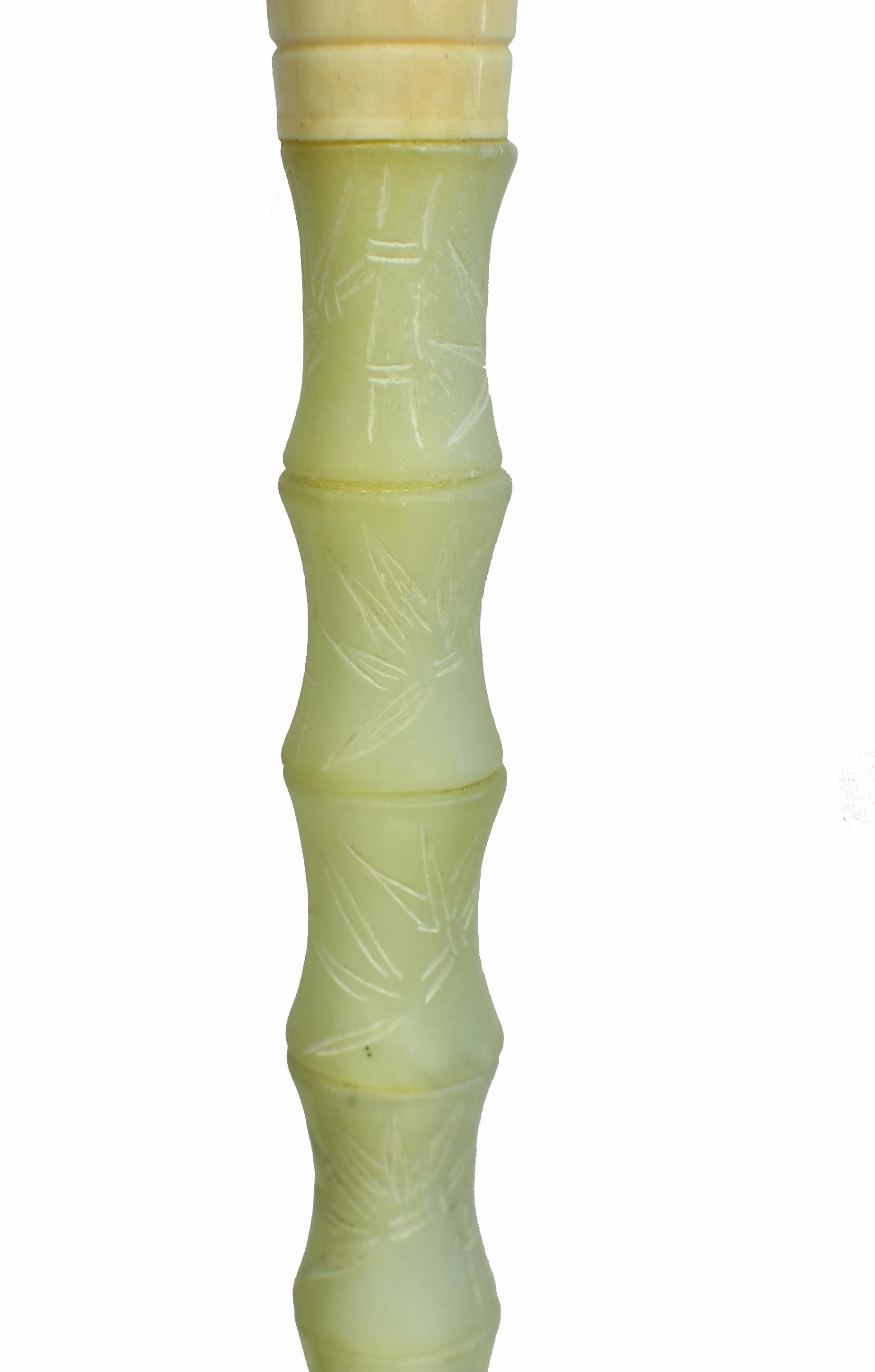 One of a kind, large green serpentine gemstone brush in bamboo form with carved bamboo leaves. Serpentine is a beautiful stone highly valued for its similarity to nephrite jade in celadon color and lustrous texture. Bone ferrule and horse hair.