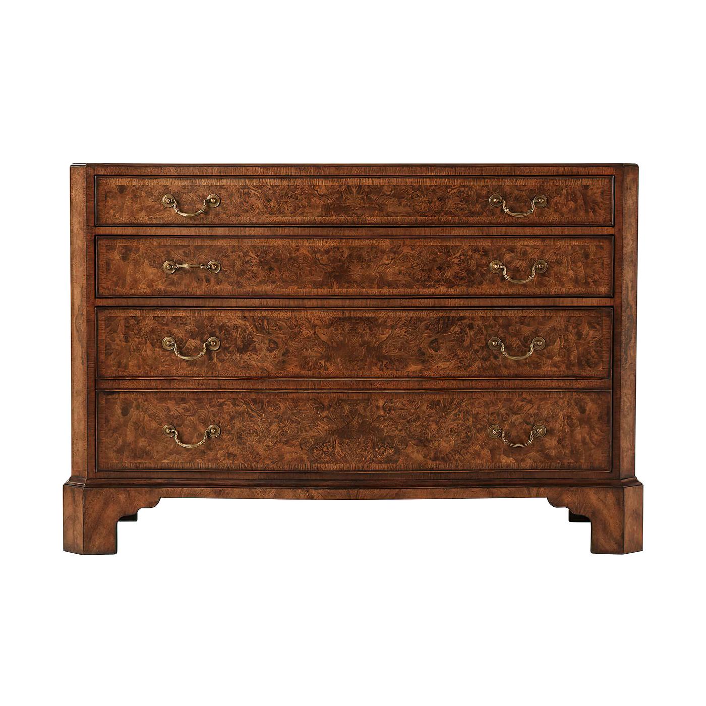 A Chippendale style serpentine form English dresser with walnut burl veneers and walnut banding, the serpentine and molded top centered by a burl oval, above three shaped and graduated drawers with cast brass handle, on bracket feet.
Dimensions: