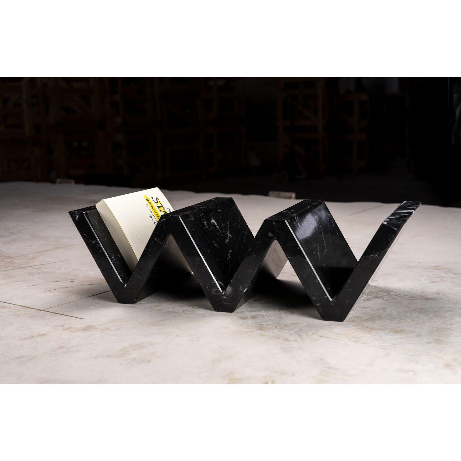 Serpentine marble book holder - small by Essenzia
Materials: Nero marquina
Dimensions: 51 x 22 x 14 cm

Also available: Carrara, India green, and large size 

Serpentine it’s an innovating solution with multiple purposes. It can be used as a
