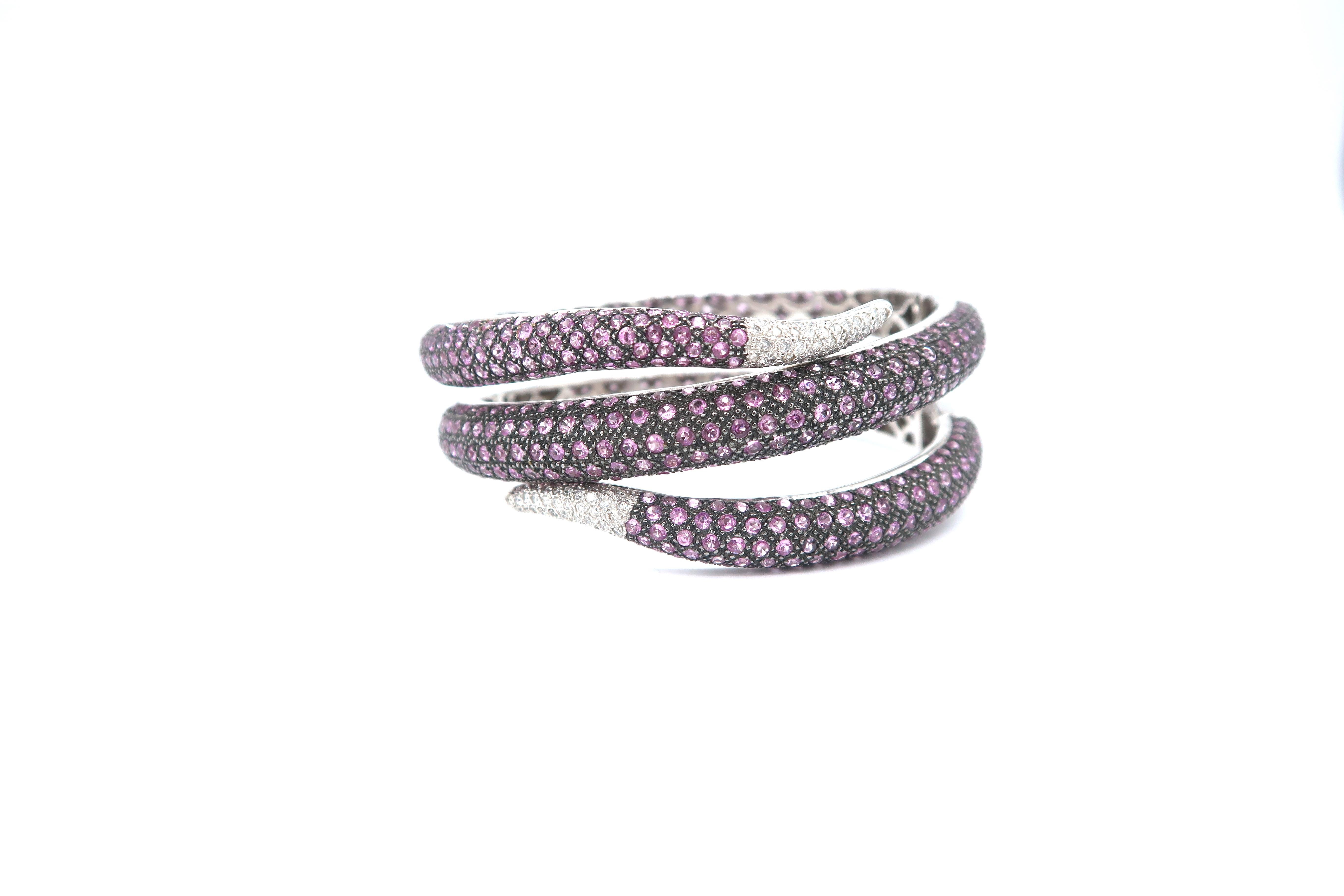 Serpentine Pink Sapphire and Diamond Pavé Hinged Cuff Bangle in 18K White Gold

Pink Sapphire: 23.62cts.
Diamond: 0.70ct.
Gold: 18K White Gold 99.852g.