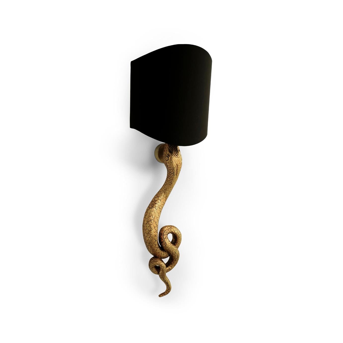 Slithering up the wall, the Serpentine Sconce's coiled tail appears as if it may unwind at any moment. Looking to add some primal energy to your interior? This sconce is sure to add a sense of primitive exoticism to any space.