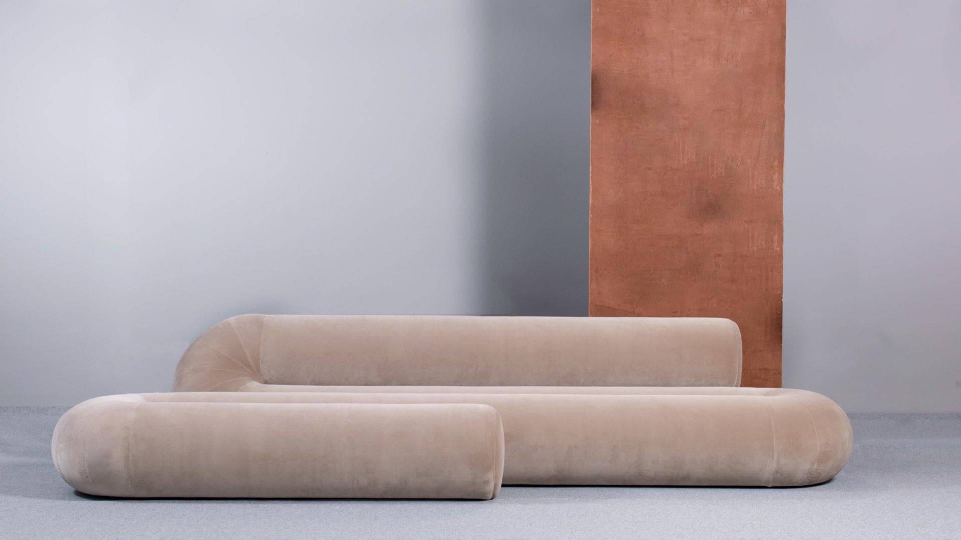 Serpentine takes the challenge of rethinking a modern sofa by incorporating different seating solutions in one fluid object. The alternation of back and leg support mimics the functionality of a classic seat, a pouf, and a chaise longue. Serpentine